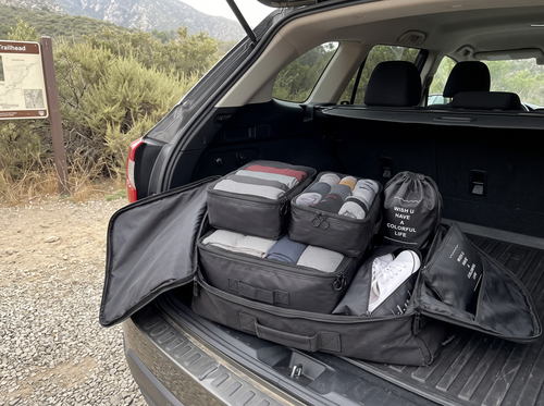Packing cubes in a duffel bag in an SUV boot