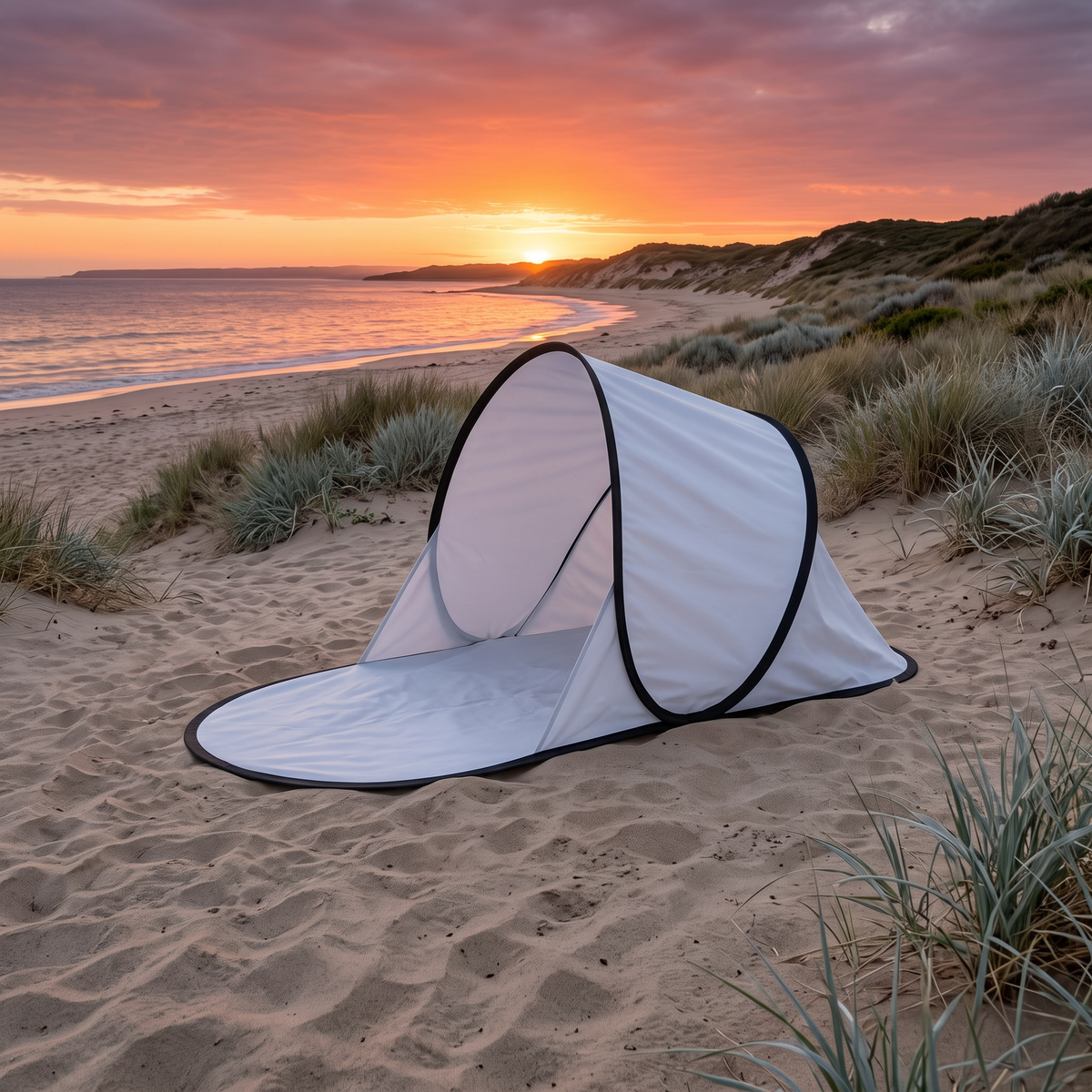 Pop-up shade on the beach at sunset